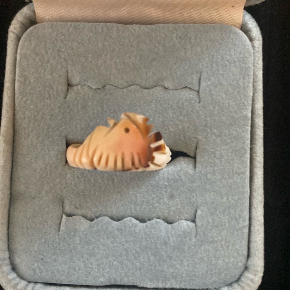 Carved-bird shell cream-colored ring.